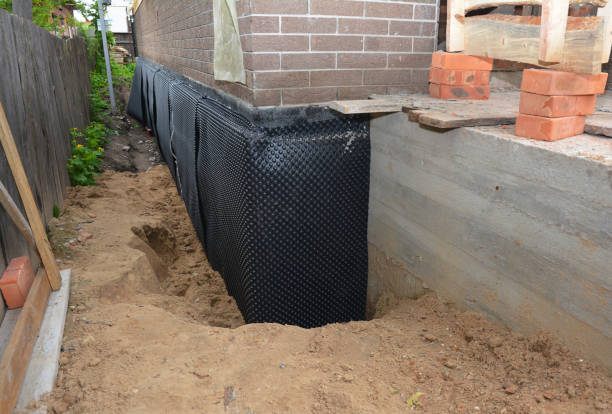 SJ Waterproofing Pros technician performing targeted Exterior Waterproofing assessment in Benton, IL